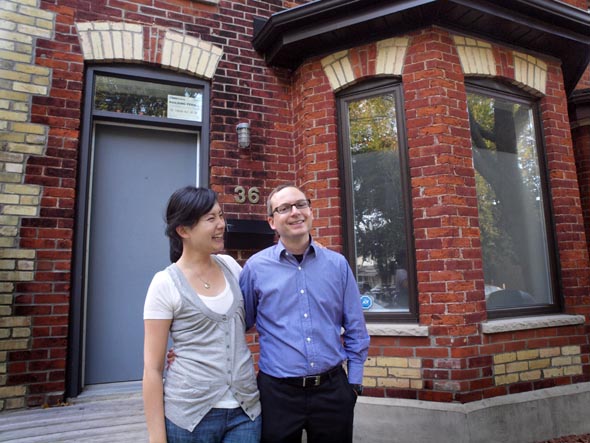 Danielle Lam-Kukzak and Joe Troppman in front of their home